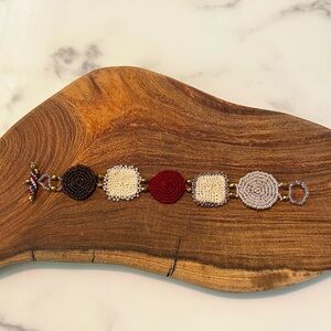 Beaded and Crocheted Bracelet with Red, Cream, and Brown Accents